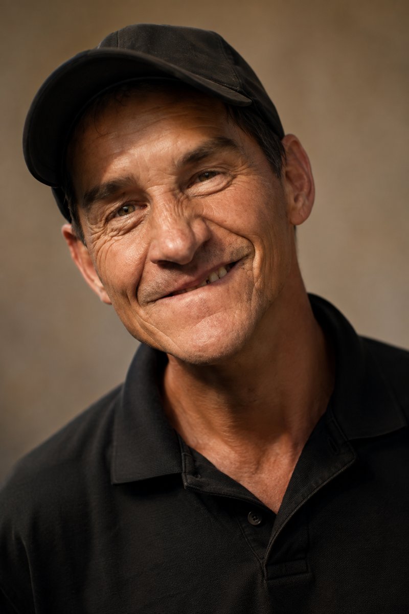 Marty Turcios, founder of Marty Turcios Therapeutic Golf, smiling in a ball cap and polo shirt